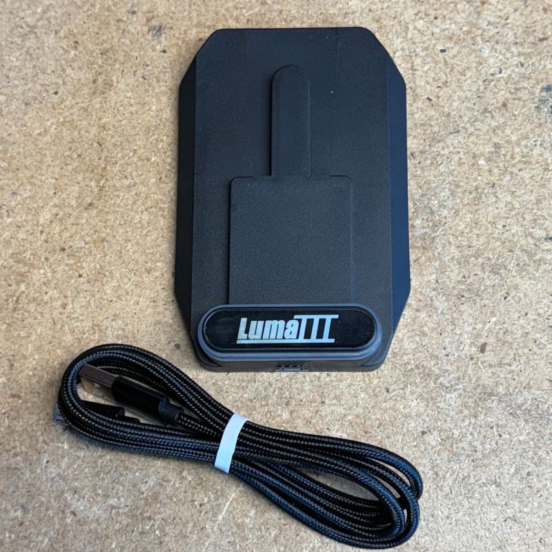 Charging dock for Luma III SunPro spray gun light attachment.