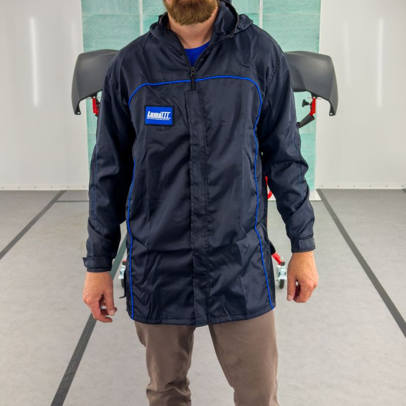 Person in a spray booth wearing Luma III Lab Coat.